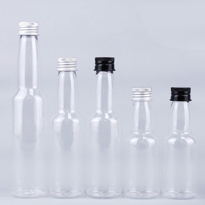 गर्म बिक्री 50ml पारदर्शी गोल प्लास्टिक पीईटी एल्यूमीनियम ढक्कन के साथ शराब की बोतल