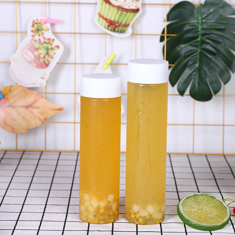 हैंडल यस मिल्क टी बोतलें 05 किग्रा स्क्रू ऑन ढक्कन लीक प्रूफ डिज़ाइन व्यावसायिक पेय पैकेजिंग और वितरण के लिए आदर्श